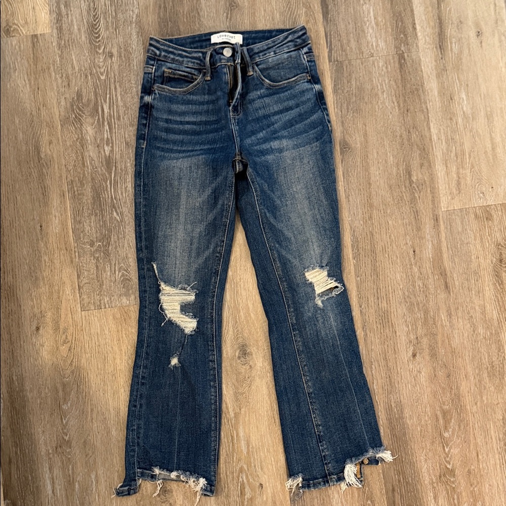 Distressed Dark Blue Flare Jeans with Frayed Hem